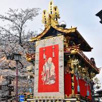 Men in feudal costumes pull a festival float decorated with gold-plated ornaments in Takayama, Gifu Prefecture, on Thursday, the first day of the spring Takayama Festival. In the Edo Period, the area prospered as a castle town under the Hida-Takayama clan. | KYODO