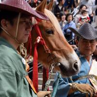 Archers prepare for Asakusa Yabusame, a horseback archery display, held annually at Sumida Park near Asakusa in Tokyo. This year 30 mounted archers participated in the event, which was held on April 16. | SATOKO KAWASAKI