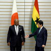 Ghana President John Dramani Mahama is greeted by Prime Minister Shinzo Abe before their talks at Abe\'s office in Tokyo on Wednesday. | AP