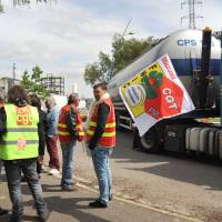 CGT and FO union members stand in solidarity before upcoming strike activity at the Notre-Dame-de-Gravenchon refinery, western France, Wednesday. | AP