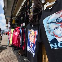 T-shirts with pictures depicting U.S. Republican presidential candidate Donald Trump are displayed at a shop on the boardwalk in Atlantic City, New Jersey, on Sunday.  | AFP-JIJI