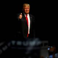 Republican U.S. presidential candidate Donald Trump arrives at a campaign rally in Eugene, Oregon, Friday. | REUTERS