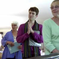 Choral care: In a still from a video, members of Journey Songs sing as they depart the home of Norman Doelling. Hospice choirs provide peace and comfort