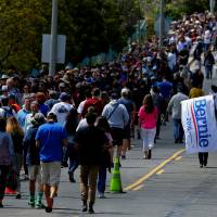Hundreds of supporters wait in line to attend a rally for U.S. Democratic presidential candidate Bernie Sanders in Vista, California, Sunday. | REUTERS