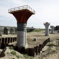 Supports for a viaduct to carry high-speed train tracks across the Fresno River are seen under construction near Madera, California, on Feb. 26. | AP