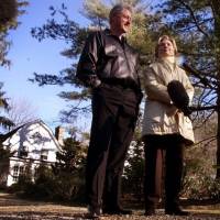 Bill and Hillary Clinton stand in the driveway of their new home in Chappaqua, New York, in January 2000. In U.S. presidential election, a billionaire and a millionaire claim populist mantle