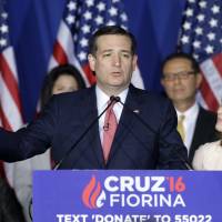 Republican presidential candidate Sen. Ted Cruz speaks as his wife, Heidi, listens during a primary night campaign event Tuesday in Indianapolis. Cruz dropped out of the presidential race after he was trounced in the Indiana primary by Donald Trump. | AP