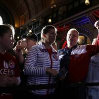 Supporters for Republican presidential candidate Sen. Ted Cruz react after the Indiana primary was called for Republican presidential candidate Donald Trump, Tuesday in Indianapolis. | AP