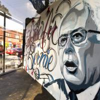 Bernie Sanders\'s image gazes out from a corner storefront May 19 in the Boyle Heights district of Los Angeles. Sanders\' campaign is mining deep into voter data from Hispanic enclaves, scouting for hidden supporters in an effort to undercut Hillary Clinton in a contest that he has vowed to fight to the end. | AP