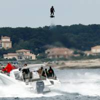 Pilot and jet-ski champion Franky Zapata hovers in the air on an IPU Flyboard Air hoverboard as he breaks the Guiness World Records for farthest flight by hoverboard, after covering a distance of 2,252.4 meters ith an average speed of 50-60 kph, in Sausset les Pins near Marseille, France, Saturday. Frenchman scores Guinness record with hoverboard flight of over 2 km