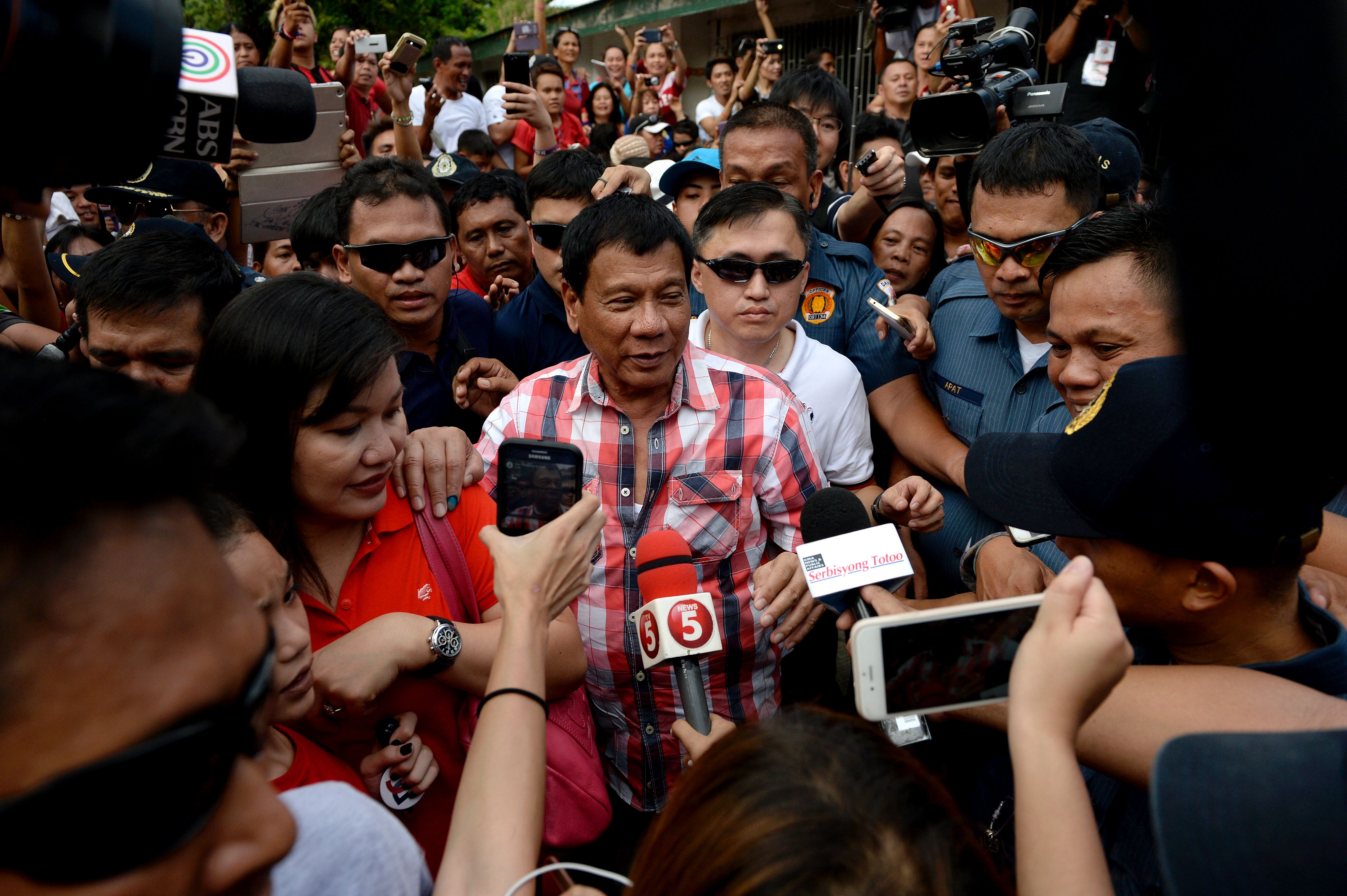 Rodrigo Duterte, who was set to become the next Philippine leader after garnering an insurmountable election lead, leaves after casting his vote at Daniel Aguinaldo National High School in the southern city of Davao on Monday. | AFP-JIJI
