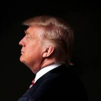 Republican presidential candidate Donald Trump poses for a photo Tuesday after an interview in his office in the Trump Tower in Manhattan. | REUTERS
