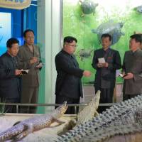 This undated picture released by North Korea\'s official Korean Central News Agency (KCNA) on Saturday shows North Korean leader Kim Jong-Un (center) inspecting a new nature museum in Pyongyang. | KCNA / AFP-JIJI