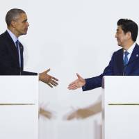 U.S. President Barack Obama and Prime Minister Shinzo Abe appear together at a news conference after meeting in Shima, Mie Prefecture, on Wednesday evening. | AFP-JIJI