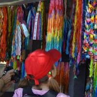 Visitors view paper cranes dedicated to the victims of the atomic bombing at Peace Memorial Park in Hiroshima on May 17. | SATOKO KAWASAKI