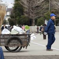 A man wheels his cart on the grounds of Sensoji Temple in Tokyo\'s Asakusa district. According to the metropolitan government, the number of homeless people in the capital hit a record low this past winter, but advocates say they are becoming increasingly harder to track. | ISTOCK