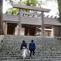 People visit the inner sanctum of Ise Shrine Wednesday in Ise, Mie Prefecture. | KYODO