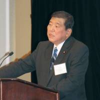 Shigeru Ishiba, regional revitalization minister, gives a speech in Washington on Friday. 				KYODO | KYODO