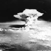 A cloud of dust and smoke billows over Hiroshima after the detonation of the first atomic bomb in this handout photo taken by the U.S. Army on Aug. 6, 1945, and distributed by the Hiroshima Peace Memorial Museum. | REUTERS