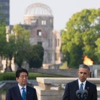 U.S. President Barack Obama and Prime Minister Shinzo Abe deliver remarks after laying wreaths at Hiroshima Peace Memorial Park in Hiroshima on Friday. | AFP-JIJI