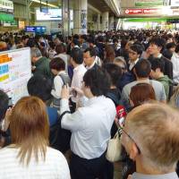 JR Kawasaki Station is filled with passengers Thursday morning after the Keihin and Tokaido lines stopped services following a power outage at an electrical substation in Kawasaki, Kanagawa Prefecture. | KYODO