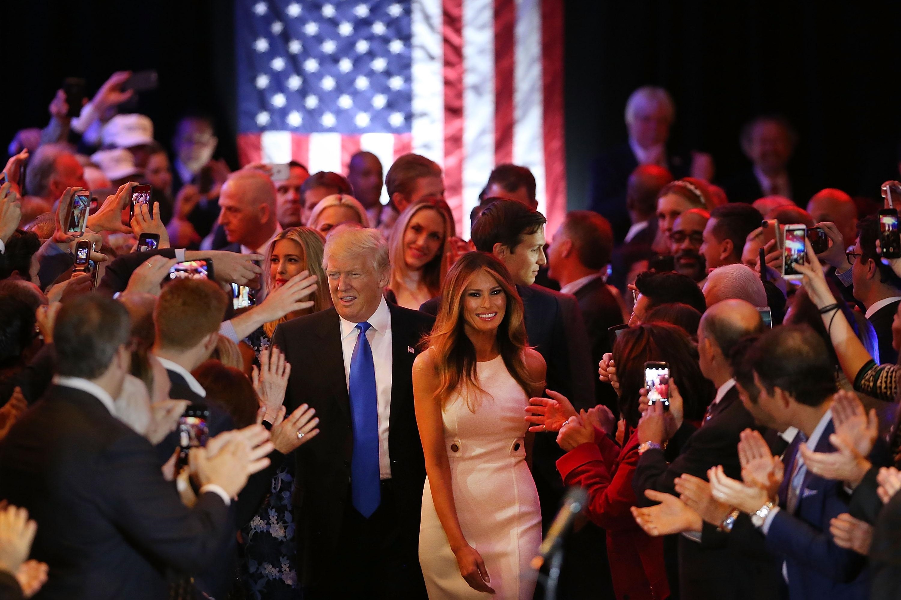 Republican presidential candidate Donald Trump and his wife, Melania, arrive to speak to supporters at Trump Tower in Manhattan on Tuesday following his victory in the Indiana primary. | GETTY / KYODO