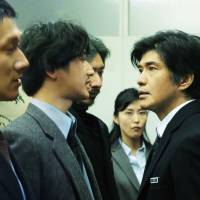 When two eras collide: Koichi Sato as National Police Agency spokesman Mikami gets into a heated argument with the young news reporter Akikawa, played by Eita. | &#169; 2016 64 FILM PRODUCTION COMMITTEE