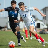 England\'s Jack Grealish (right) competes against Japan\'s Sai Van Vermeskerken during their match on Friday in Toulon, France. | AFP-JIJI