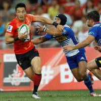 Sunwolves winger Akihito Yamada holds off a Stormers player during Saturday night\'s 17-17 draw in Singapore. | REUTERS