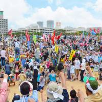 Protesters opposed to the relocation of U.S. Marine Corps Air Station Futenma from Ginowan to the Henoko district of Nago in northern Okinawa Prefecture attend a rally Sunday in Naha to mark the 44th anniversary of Okinawa\'s reversion to Japan. Organizers said about 2,500 people took part in the event. | KYODO