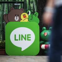 Line Corp.\'s logo is seen in this photo taken in Hong Kong. The mobile messaging service provider will reportedly make its debut on the Tokyo Stock Exchange in July. | BLOOMBERG