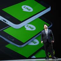 Line Corp. Chief Strategy and Marketing Officer Jun Masuda speaks during a news conference in Urayasu, Chiba Prefecture, in March. | AP