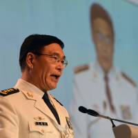 Chinese Adm. Sun Jianguo, deputy chief of general staff of the Chinese People\'s Liberation Army (PLA), delivers his speech during a plenary session at the 15th International Institute for Strategic Studies (IISS) Shangri-La Dialogue in Singapore on Sunday. | AFP-JIJI