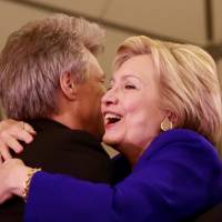 Democratic U.S. presidential candidate Hillary Clinton embraces rocker Bon Jovi during a campaign stop at Rutgers University\'s Newark campus in Newark, New Jersey, Wednesday. | REUTERS