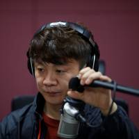 Kim Chung-seong, a North Korean defector and a Christian missionary, makes a radio broadcast in Seoul on April 21. | REUTERS
