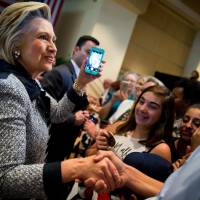 Democratic presidential candidate Hillary Clinton greets the audience after speaking at a rally at the International Brotherhood of Electrical Workers Circuit Center in Pittsburgh, Tuesday. | AP