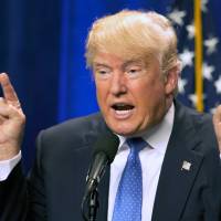 Republican U.S. presidential candidate Donald Trump speaks at Saint Anselm College in Manchester, New Hampshire, on Monday. | AP