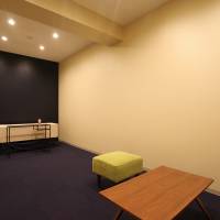 This room at Sou Sou, a so-called corpse hotel in Kawasaki, has a trolley for the coffin and seating for mourners. | COURTESY OF SOU SOU