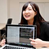 Computer programmer Emi Morikawa, 17, who launched her own company, is interviewed in Shibuya Ward, Tokyo, on May 16. Computer programming seen as key to Japan's place in 'fourth industrial revolution'