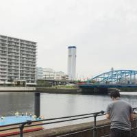 A suitcase containing a woman\'s body was found floating in the Keihin Canal, seen in this photograph, in Shinagawa Ward, Tokyo, on Monday. | KYODO