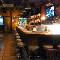 Jammin, a bar on Dobuita-Dori in Yokosuka, Kanagawa Prefecture, is deserted on Wednesday. Bar owners say the drinking ban, still in place for off-base establishments, is hurting them hard. | DAISUKE KIKUCHI
