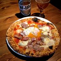 Naples-trained: One of Hazama’s most popular offerings is his sausage and soft-cooked egg pizza. | ROBBIE SWINNERTON