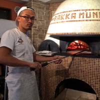 Yutaka Hazama, the owner of Bakka M’unica, has entered pizzaiolo competitions in Naples but prefers to follow his own unorthodox path. Before opening Bakka M’unica in the spring of 2016, he operated out of his pizza truck. | ROBBIE SWINNERTON