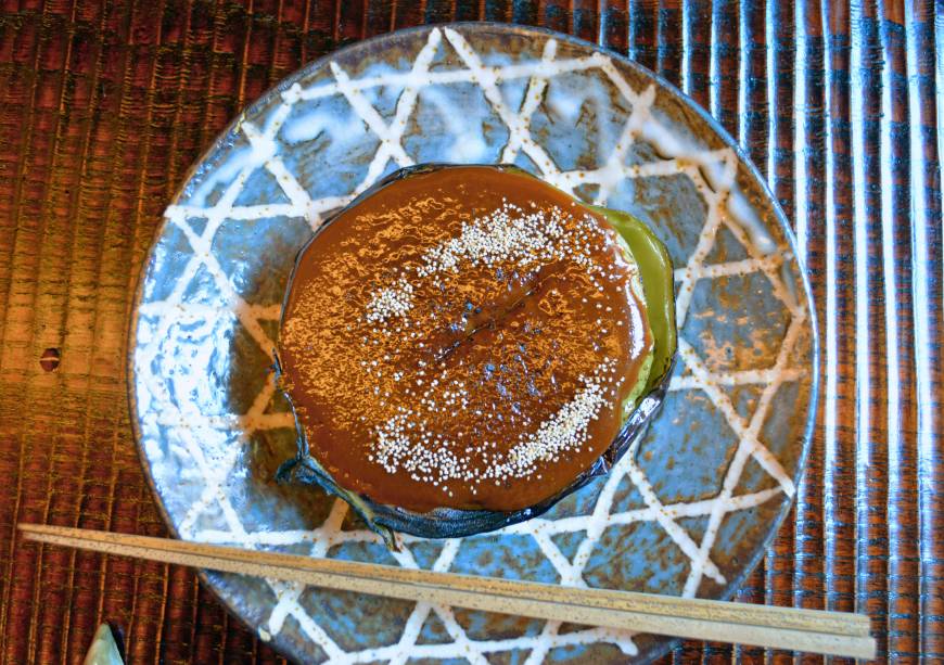 Okina Heirloom flavors: Kamonasu, a Kyoto variety of eggplant, is served as dengaku nasu, this is cut in half, smothered in white and red miso, and grilled. | J.J. O'DONOGHUE
