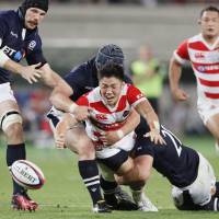 Japan\'s Shokei Kin moves for the ball against Scotland in their test match at Ajinomoto Stadium last Saturday. World Rugby announced Thursday that Kyoto will host the draw for the 2019 Rugby World Cup next May. | KYODO