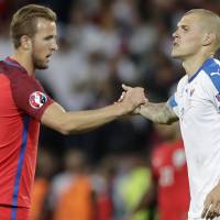 England’s Harry Kane (left) shakes hands with Slovakia’s Martin Skrtel after their match at Euro 2016 on June 20. Kane said he didn’t know much about Britain’s decision to leave the European Union. Euro 2016 players react to Brexit