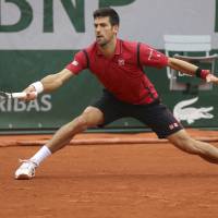 Novak Djokovic faces Tomas Berdych in the French Open quarterfinals on Thursday in Paris. Djokovic won the match 6-3, 7-5, 6-3. | AP