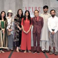 Prominent Pakistani artists (second from left) Alia Bilgrami, Amna Hashmi, Sheherbano Husain, Seyhr Qayum, Jibran Shahid, Imran Hunzai and Ilona Yusuf are joined by Pakistan Ambassador Farukh Amil (left) and actor and special guest Tsurutaro Kataoka (fourth from right) at the Artists-in-Residence art exhibition, which looks to create a fusion between Pakistani and Japanese societies, at the Embassy of Pakistan on June 2. | YOSHIAKI MIURA