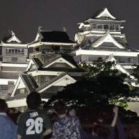 Kumamoto Castle, which sustained damage in a series of quakes in April, is lit up on Wednesday evening for the first time since the disaster. Kumamoto Mayor Kazufumi Onishi said he hoped it will become the light of hope for city residents. | KYODO