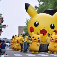 Pikachu characters parade at a festival in Yokohama in August 2015. | AFP-JIJI